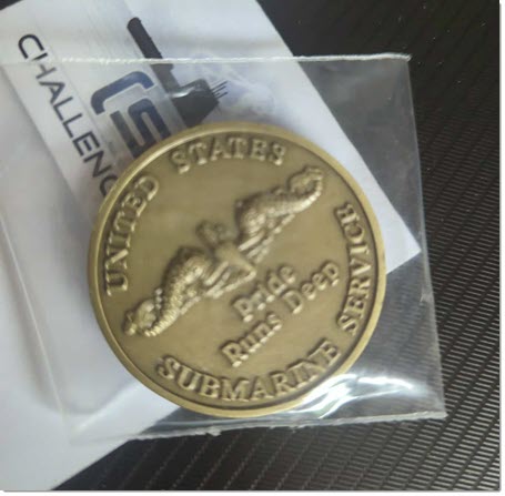 Back of Scamp challenge coin in brass with submarine dolphin insignia