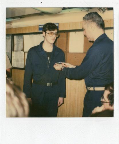 Receiving awards from the Captain